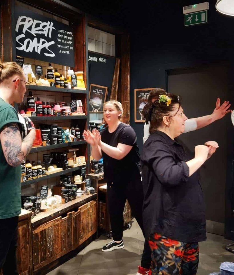 Krav Maga instructor delivering customised self-defence training in a workplace environment tailored to real-world job risks.